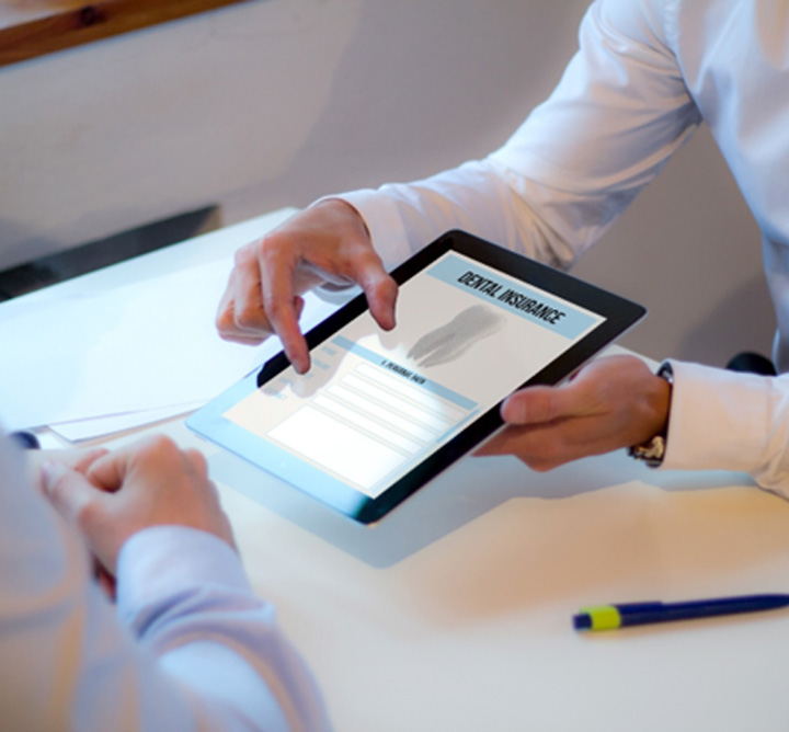 Showing patient dental insurance form on a tablet