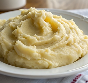 Mashed potatoes in white ceramic bowl