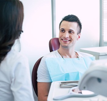 Male patient talking to his dentist