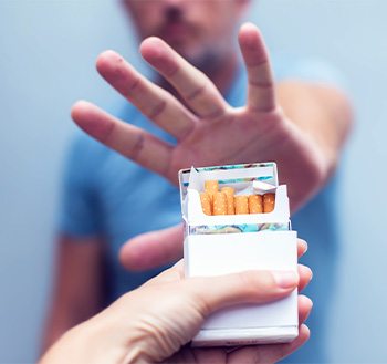 Man saying no to offer of a cigarette